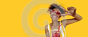 Happy young african woman hold drink wear glasses laugh look at camera
