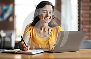 Happy young arab woman having educational course online