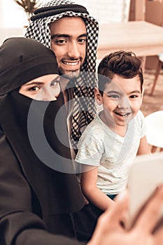 Happy Young Arabian Family Taking Selfie at Home