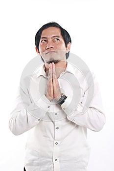 Happy Young Asian Businessman Praying