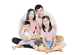 Happy young asian family sitting on floor