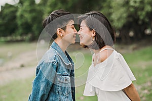 happy young Asian lesbian couple about to kissing together