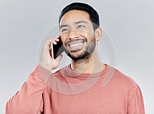 Happy, young asian man and phone call in studio for communication, networking and white background. Student male model