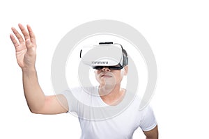 Happy young asian man using the virtual reality headset