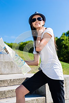 Happy young Asian tourist climbing stairs