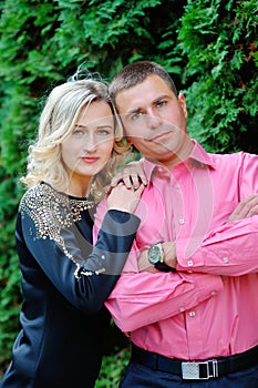 Happy young attractive couple portrait, smiling in outdoor environment