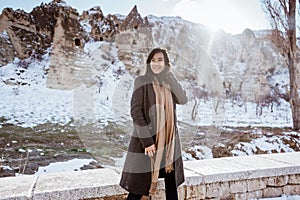 happy young attractive woman in snowy cappadocia