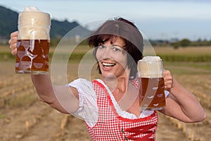 Happy young Bavarian woman celebrating Oktoberfest