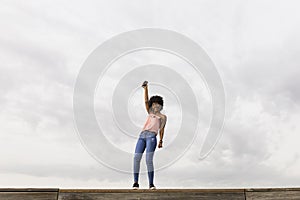 Happy young beautiful afro american woman listening to music in