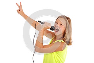 Happy young beautiful girl singing with microphone