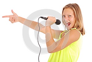 Happy young beautiful girl singing with microphone