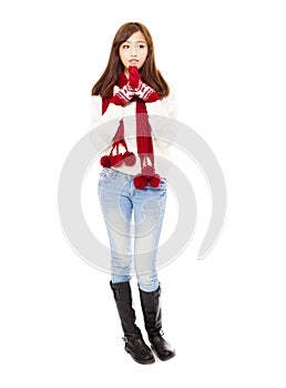Happy young beautiful woman in winter clothes and thinking