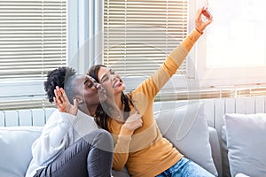 Happy young best friends having fun and smiling. Friends smiling for selfie.making selfie photo on smart phone. African American