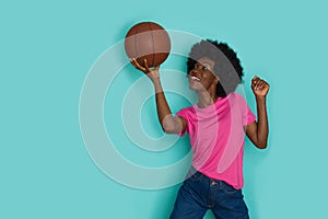 Happy Young Black Woman With Arfo Hair Is Playing With Basketball Ball