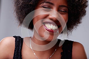 Happy young Black woman with a beaming toothy smile