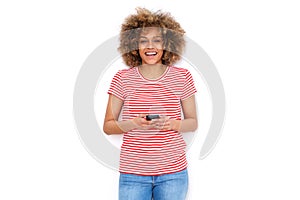 Happy young black woman holding mobile phone