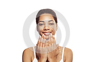 Happy young black woman smiling isolated on white background
