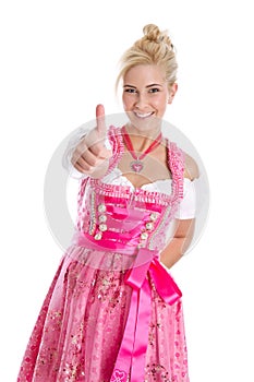 Happy young blond woman in dirndl dress in bavarian folkart. photo