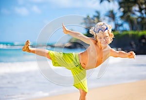 Happy young boy at the beach
