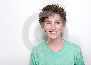 Happy young boy with curly hair smiling