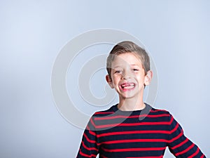 Happy young boy with front missing tooth