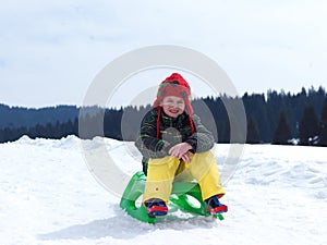 Happy young boy have fun on winter vacatioin on fresh snow