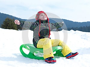 Happy young boy have fun on winter vacatioin on fresh snow