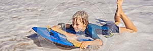 Happy Young boy having fun at the beach on vacation, with Boogie board BANNER, LONG FORMAT