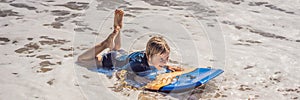 Happy Young boy having fun at the beach on vacation, with Boogie board BANNER, LONG FORMAT