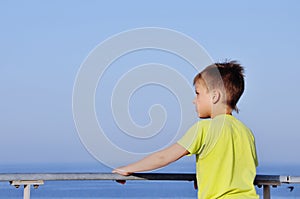 Happy young boy looking horizon
