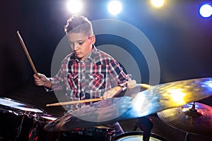 Young boy playing drums