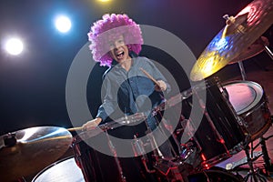 Young boy playing drums
