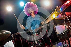 Young boy playing drums