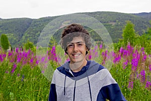 Happy young boy smiling at camera