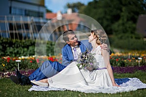 Happy young bride and groom on  wedding day. Wedding couple - new family! wedding dress. Bridal wedding bouquet of flowers