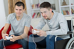 Happy young brothers playing video games
