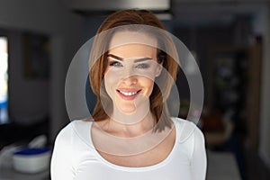 Happy young brunette Caucasian woman portrait