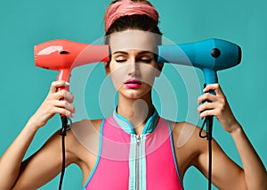 Happy young brunette woman with hair dryer on blue mint background