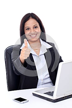 Happy young buisiness woman showing thumbs up