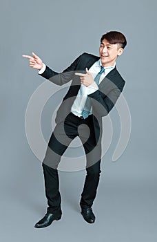 Happy young business man dancing in motion