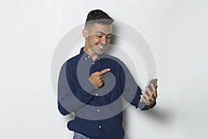 Happy young business man using mobile phone isolated on white background