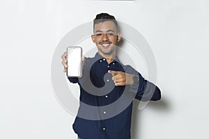 Happy young business man using mobile phone isolated on white background