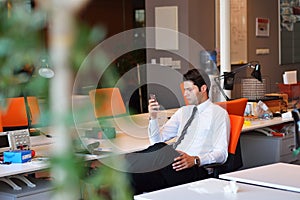 Happy young business man work in modern office on computer