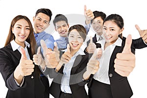 Happy Young Business team with thumbs up gesture