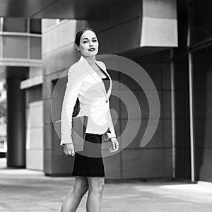 Happy young business woman with a folder