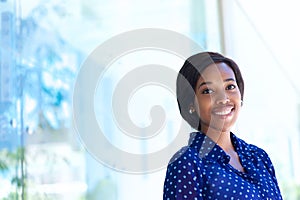 Happy young business woman standing outdoors