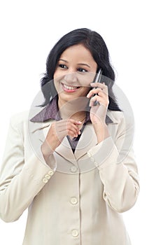 Happy young business woman talking on cell phone