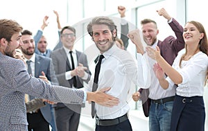 happy young businessman on business team background.