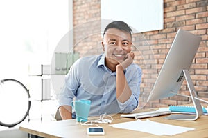 Happy young businessman enjoying peaceful moment