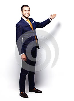 Happy Young Businessman Presenting Isolated Over White